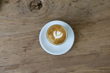 cup of coffee on wooden table, cafe latte milk coffee