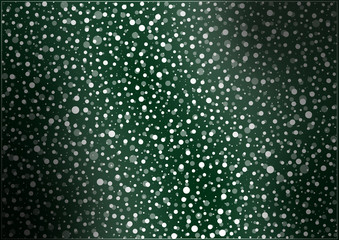 Snow flurry on green background flowing from left to right 