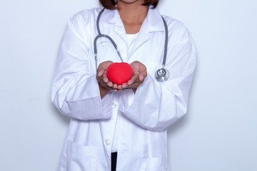 Red heart shape in doctor's hands, Healthcare And Medicine concept.