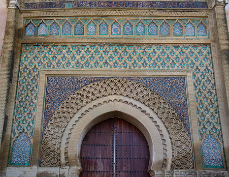 The Bab el-Mansour gate ( Bab Mansour Laleuj ) decorated with very impressive zellij (mosaic ceramic tiles) at the El Hedim square. The entrance to the old city of Meknes, Morocco