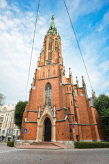 Obraz premium View on ancient Saint Gertrude Old Church and bright blue sky, Riga Latvia. St. Gertrude Old Church
