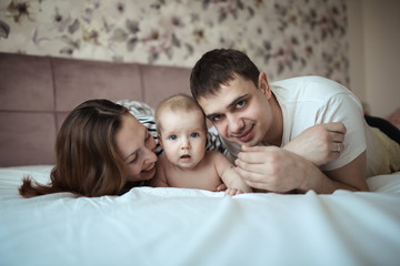 Funny happy family with one baby in real room