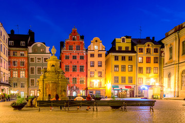 Colorful facade of the houses in Stortorget Square Gamla Stan. Stockholm, Sweden during twilight evening sunset.