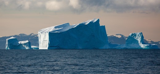 large icebergs floating in the arctic landscape