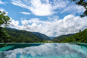 Outdoor swimming pool that reflects the sky.
