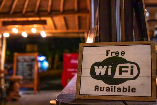 Free wifi sign wooden board in restaurant of Bali island, Indonesia.