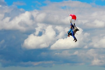 Skydiving in tke blue sky