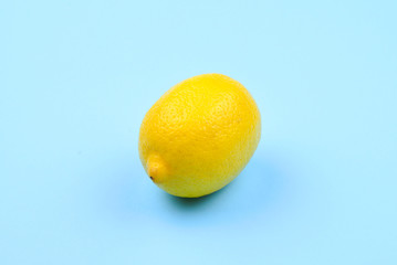 Lemon isolated on blue background. Space for test or design.