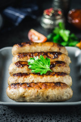 Grilled kebabs on dark background. Selective focus, space for text.