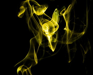 Yellow smoke on black background