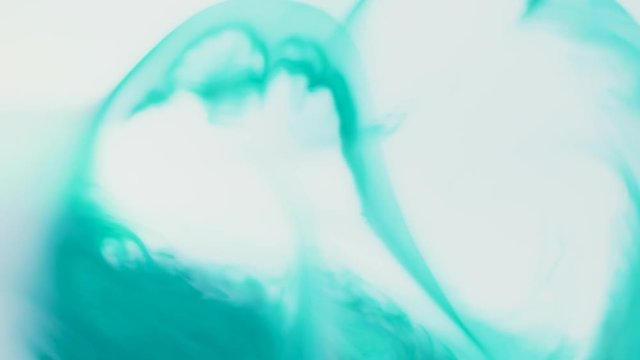 Colored paint beautiful spread in liquid, realtime shot