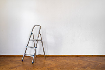 Home renovation concept - old room during restoration or refurbishment with white walls