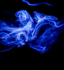 Blue smoke on black background