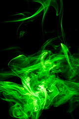 Obraz premium Green smoke on black background