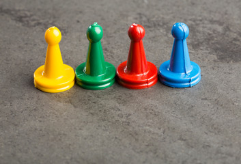 colorful play figures with dice on board