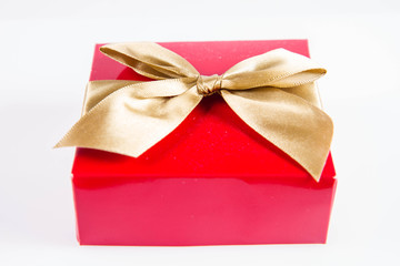 Wrapped gift with a golden ribbon on a white background