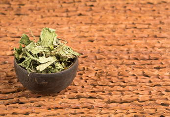 Dry dehydrated leaves of guasca - Galinsoga parviflora. Top view