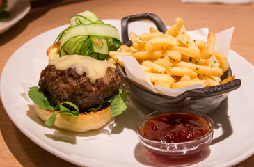 Delicious wagyu beef burger with french fried and sauce.