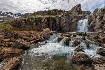 Naklejka na ściany i meble River, Waterfall and mountain landscape in Fjardabyggd municipality in Eastern Iceland