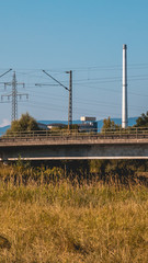 Fototapeta na wymiar Smartphone HD wallpaper of beautiful view of the railway bridge Plattling - Isar - Bavaria - Germany