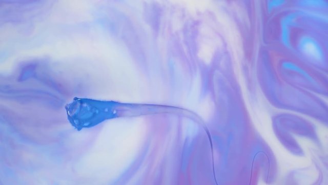 Colored paint beautiful spread in liquid, realtime shot