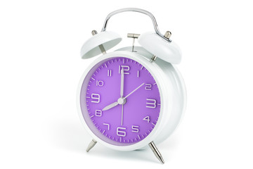 Twin bells analogue alarm clock with violet clock face shows eight o’clock, 8 AM PM; concept on white background