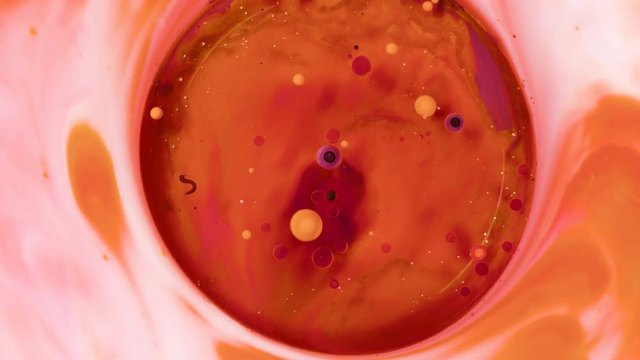 Colored paint beautiful spread in liquid, realtime shot
