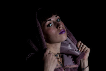 portrait of young tattooed woman with a purple sweatshirt