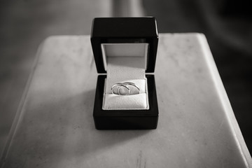 Wedding rings in a black wooden jewelry box