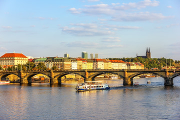 Fototapeta na wymiar Prague bridge and view on Vysehrad fort
