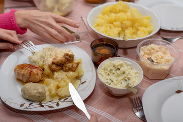 Dishes prepared for a homemade dinner. Family meeting at the kitchen table.