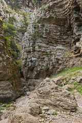 Trekking on a winding path through Imbros gorge near Chora Sfakion, island of Crete, Greece
