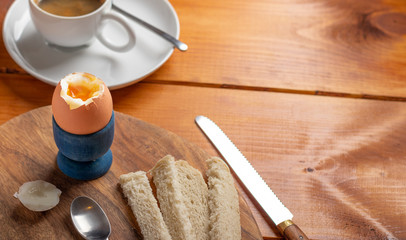 boiled egg for breakfast with white bread with coffee