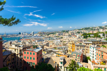 Fototapeta premium Top aerial scenic panoramic view from above of old historical centre quarter and modern districts of european city Genoa (Genova) and harbor of Ligurian and Mediterranean Sea, Liguria, Italy