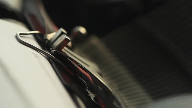 Typewriter type guide and typebars macro slow motion with selective focus