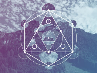 Collage with the mountains and forest and the sacred geometry symbol