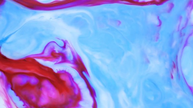 Colored paint beautiful spread in liquid, realtime shot