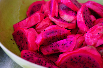 Fototapeta na wymiar Cut slices of white and pink dragon fruit (pitaya)