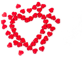 Valentine's day scattered red hearts on white background