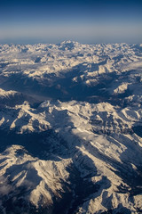 Swiss Alpes with snowy mountain tops aerial