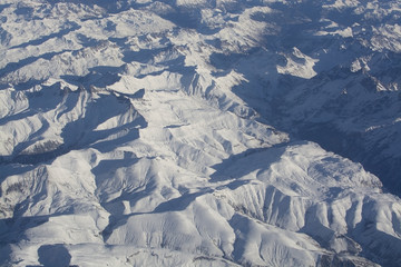 Swiss Alpes with snowy mountain tops aerial