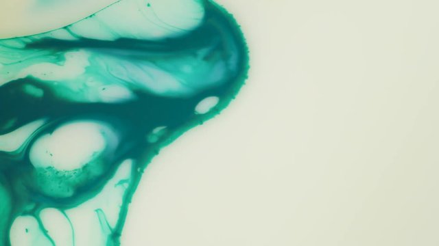 Colored paint beautiful spread in liquid, realtime shot
