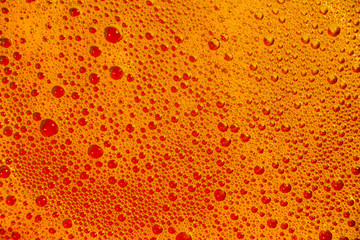 yellow-orange liquid soap bubbles as a background or graphic resource.