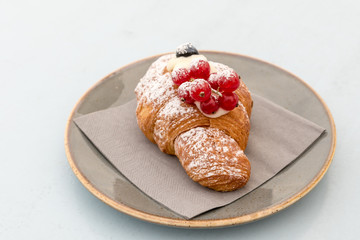 Creamy croissant with berries