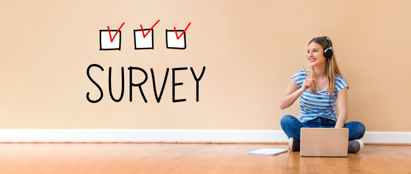 Survey with young woman with headphones using a laptop computer and a pencil - Powered by Adobe