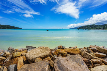 beautiful lagoon with boats behind a stone wall, seychelles 2