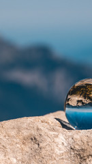 Fototapeta na wymiar Smartphone HD wallpaper of crystal ball alpine landscape shot at the Kehlsteinhaus - Berchtesgaden - Bavaria - Germany
