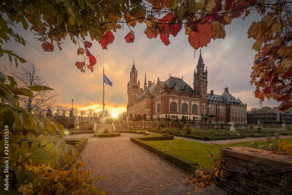 Wall mural THE HAGUE, 19 November 2018 - Cloudy early morning on the Peace Palace garden, seat of the International Court of Justice, principal judicial organ of the United Nations, Netherlands