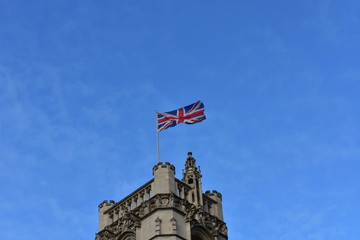 Union Jack, flag of the United Kingdom on a building. London, City of Westminster, Great Britain.