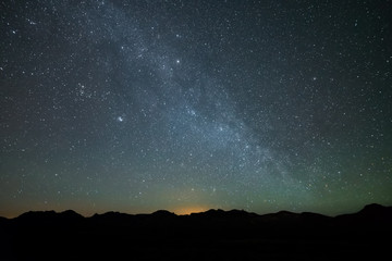 Fototapeta na wymiar Milky Way Above the neon glow from Reno Nevada hotels and casinos